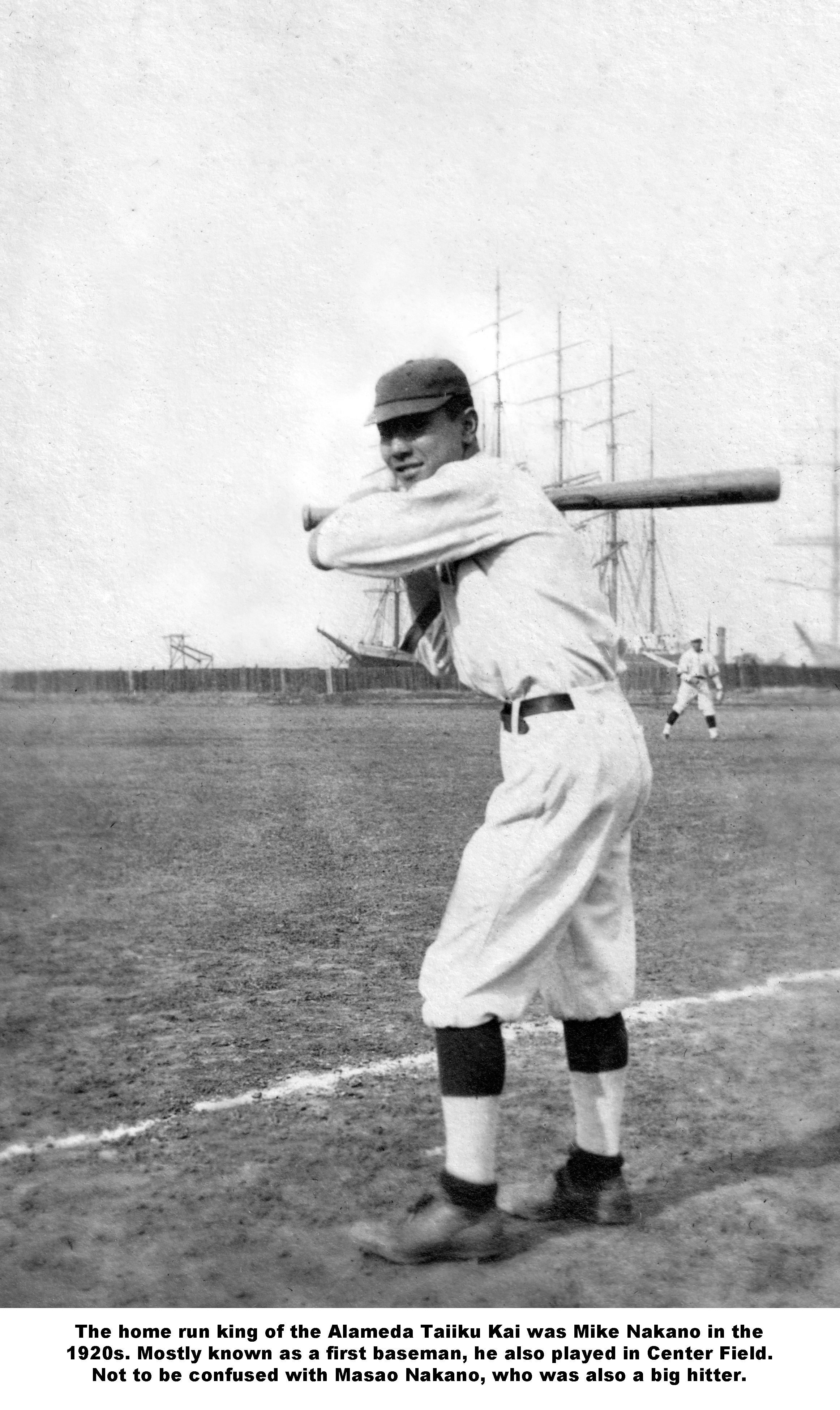 ddr-ajah-5-58 — Man in baseball uniform with bat and ships in the  background